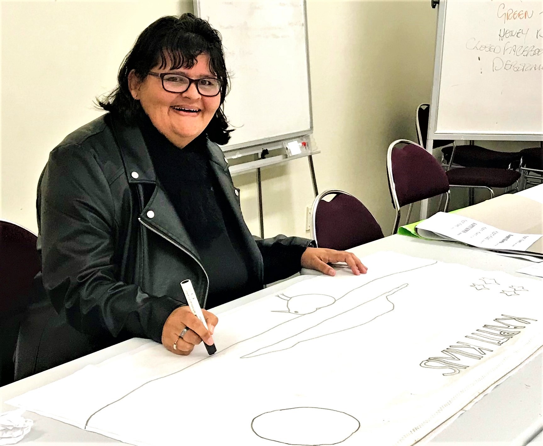 Kapiti Kiwis – The artist Helen Wildin Jane, from the Kāpiti Kiwis network group, drawing up a design for their logo